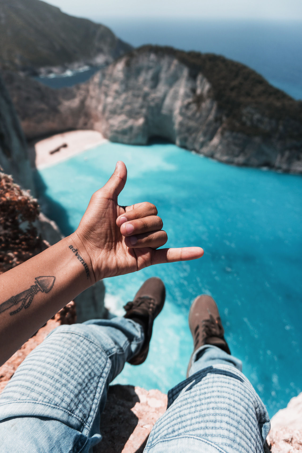 "Navagio" beach in Zakynthos with white cliffs, turquoise water and white sand