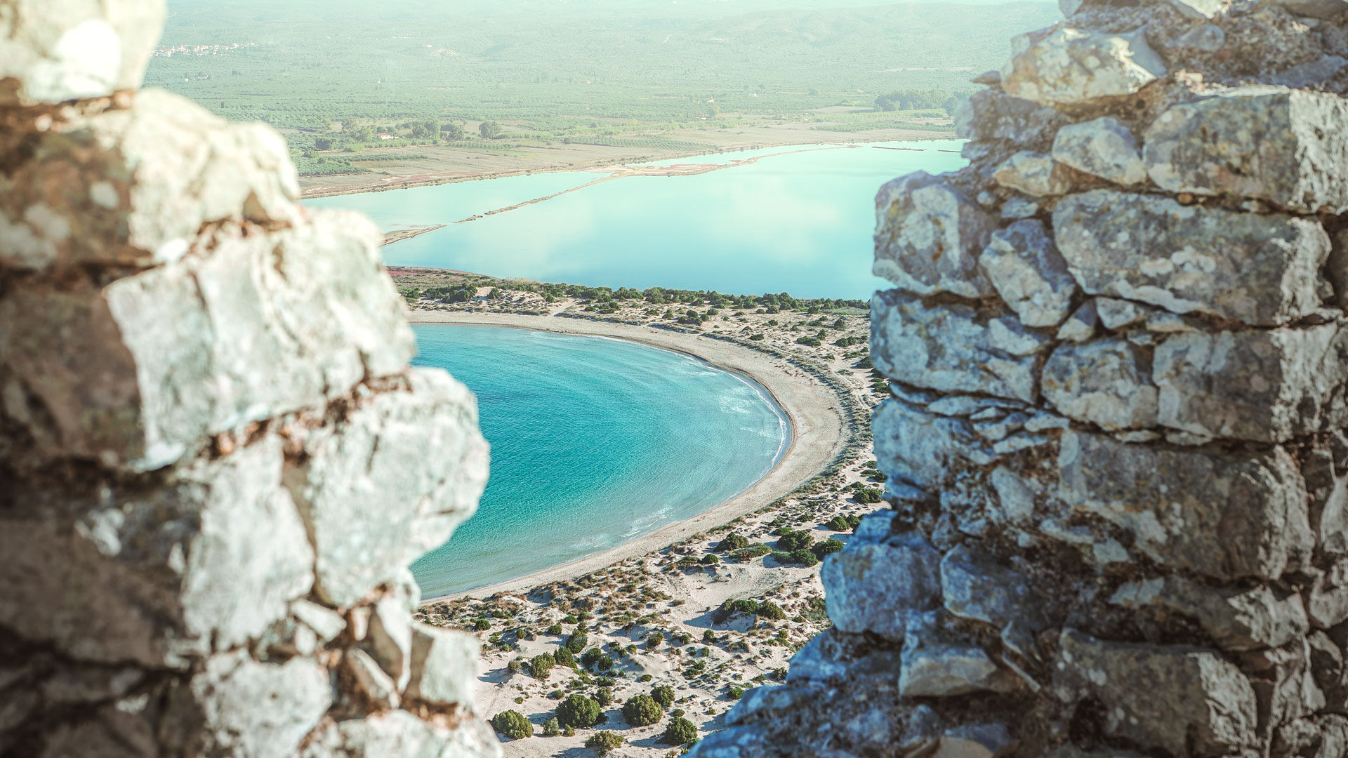 Find time to explore the beach, picking up the path beyond the sand dunes at the far end that leads up to Nestor’s Caves