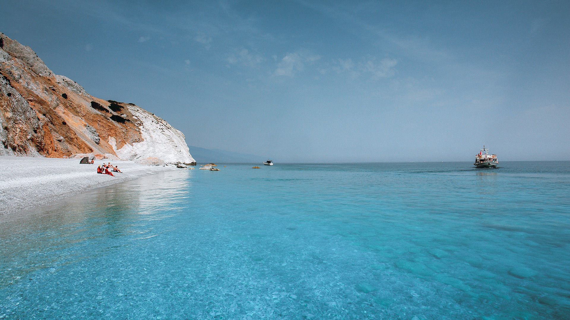 Lalaria’s unique shiny pebbles and other-worldly setting make for an unforgettable day trip