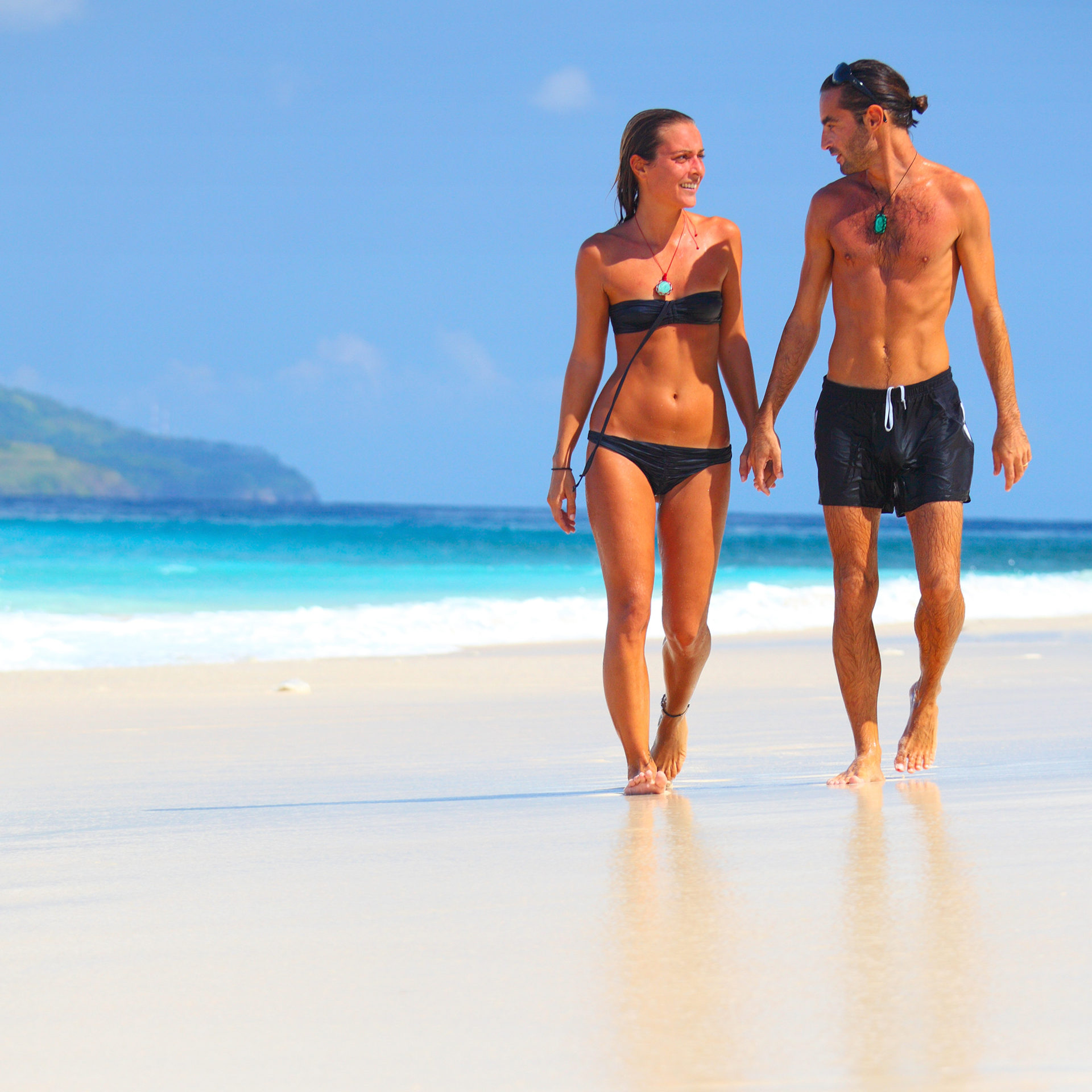 Walking along the coastline on a sandy beach