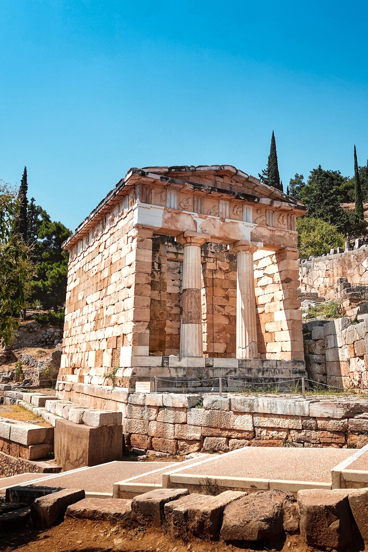 The Athenian Treasury, the best preserved of the treasuries, containing the monuments and gifts of victorious city states