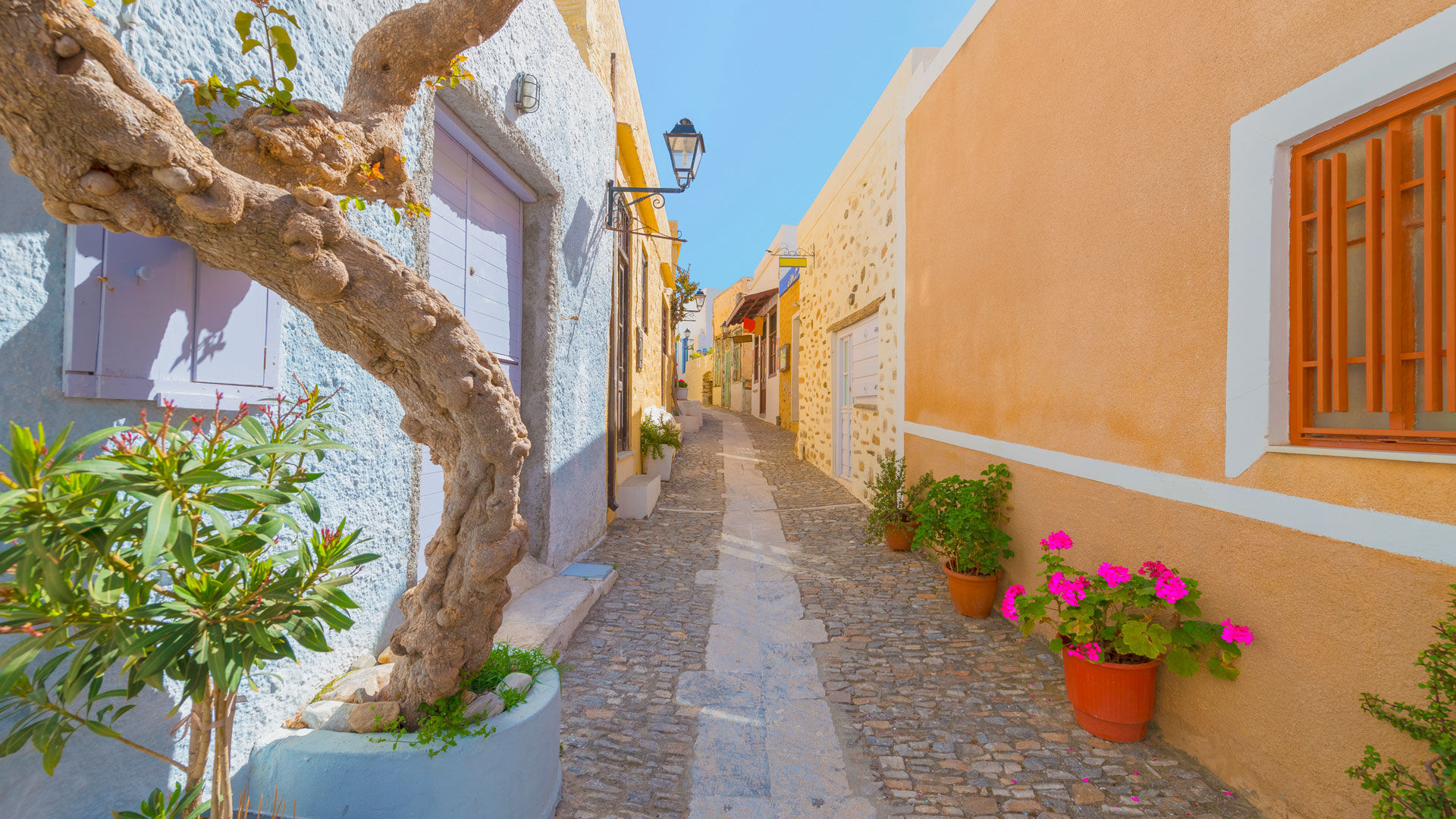 Street view of traditional Greek houses in chora, Siros