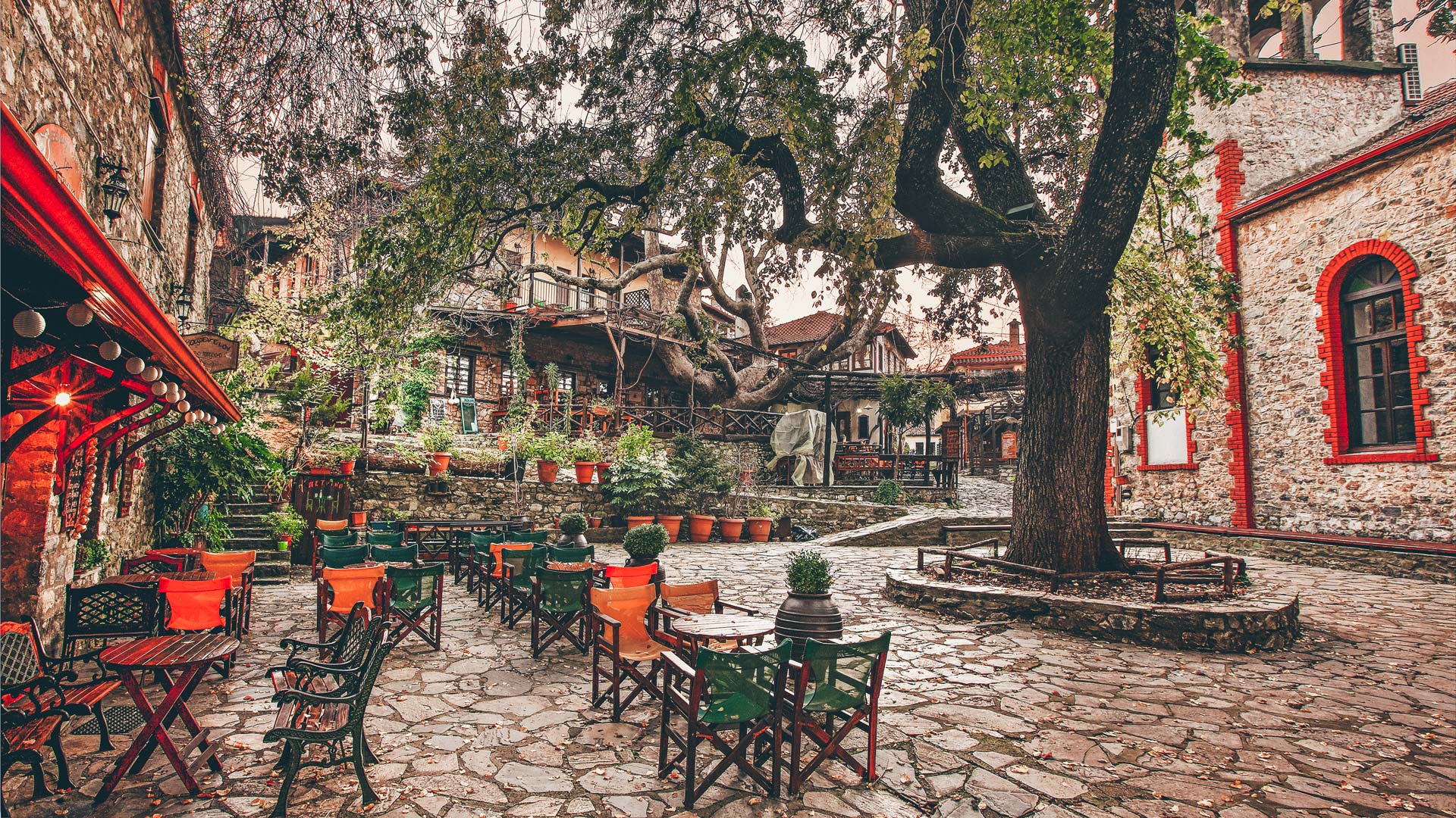 The picturesque square of Palaios Panteleimonas village around sunset , Pieria