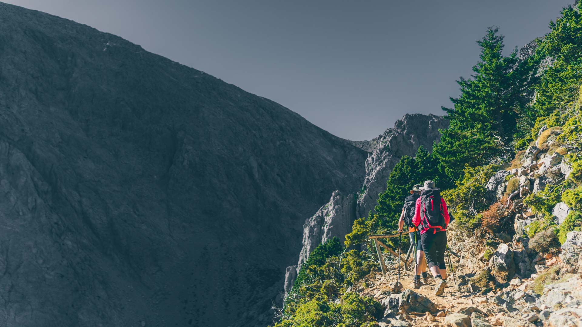 Along the way you will meet beautiful rock formations and cypress trees hanging on the edge of the path to Gigilos peak