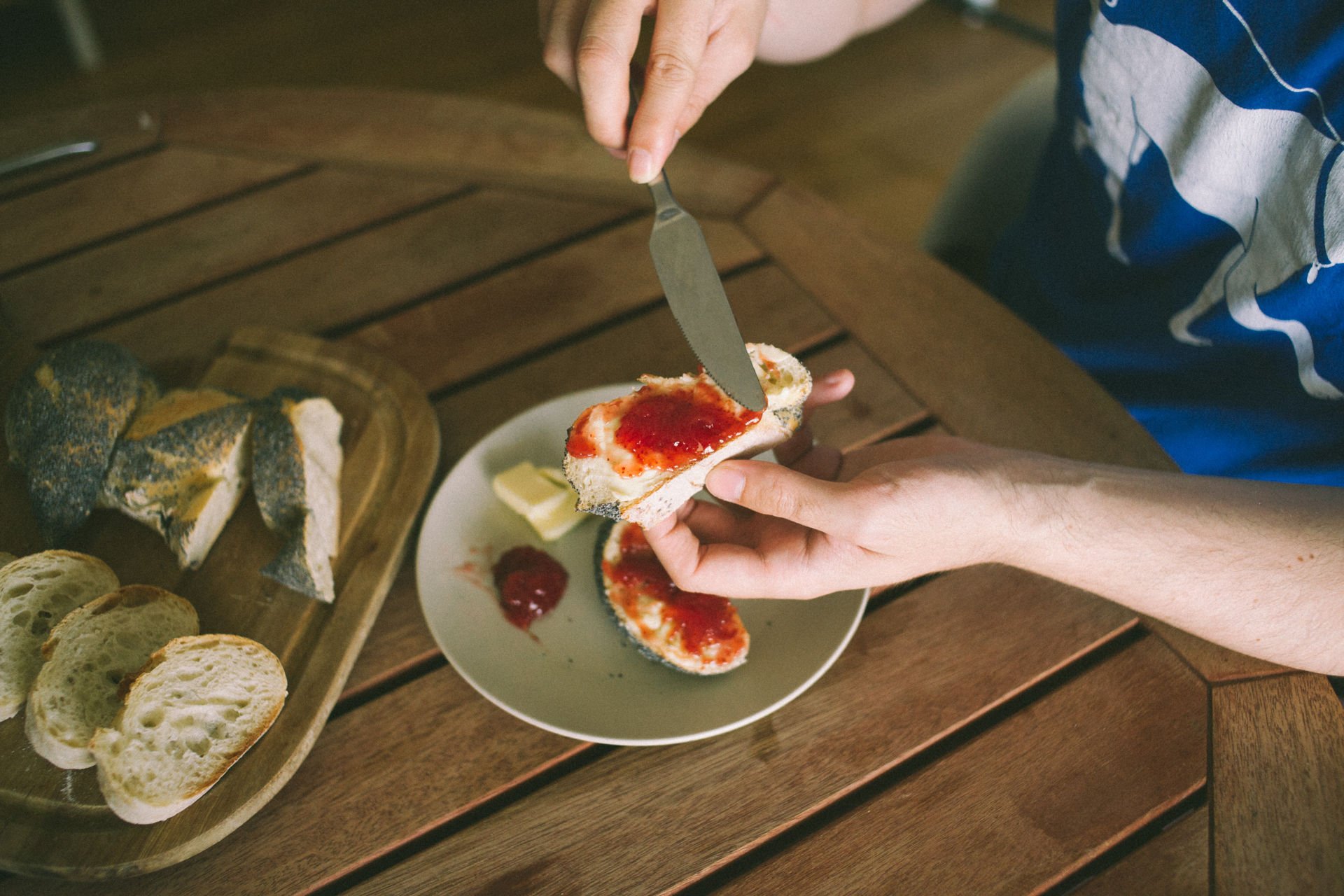 Strawberry jam spread on fresh bread