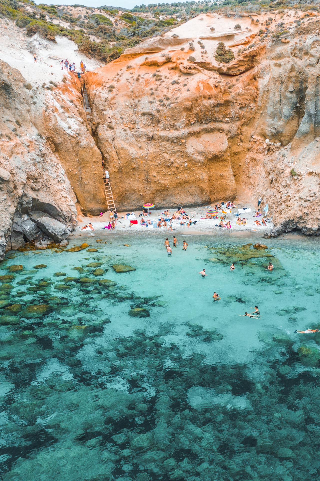 Nestled beneath vertical cliffs, this small beach offers wonderful isolation and beautiful swimming
