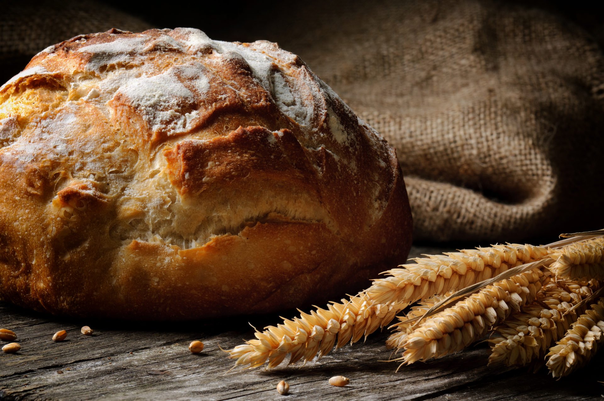 Freshly baked traditional bread on wooden table