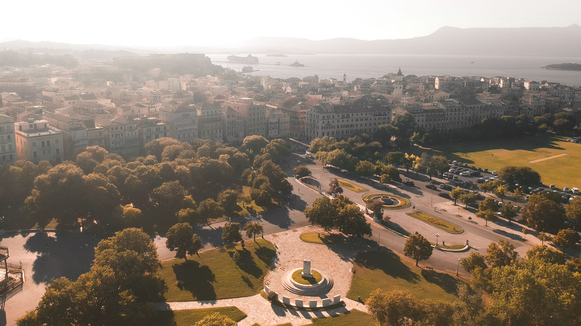 Take a moment to walk through the grass-filled Spianada, with its fountain and cafe and open areas
