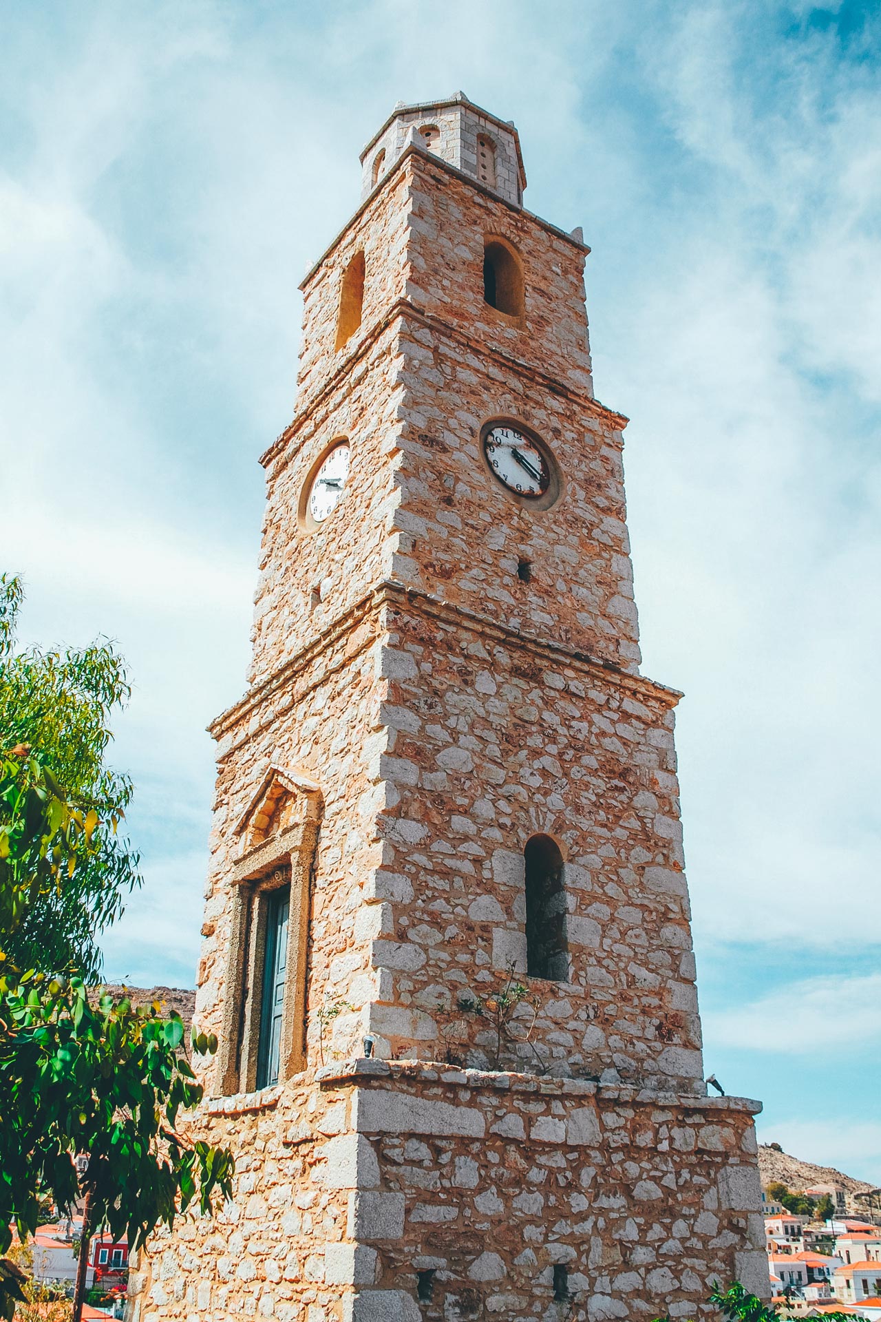 The 19th century church of St Nicholas, with its bell tower supported by an arch partially built using ancient columns