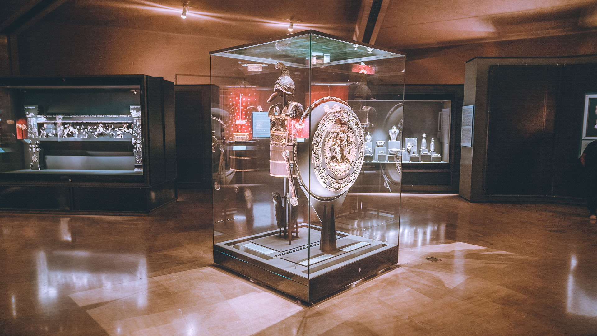 The immense armour of King Philip II, displayed in evocatively dimmed light