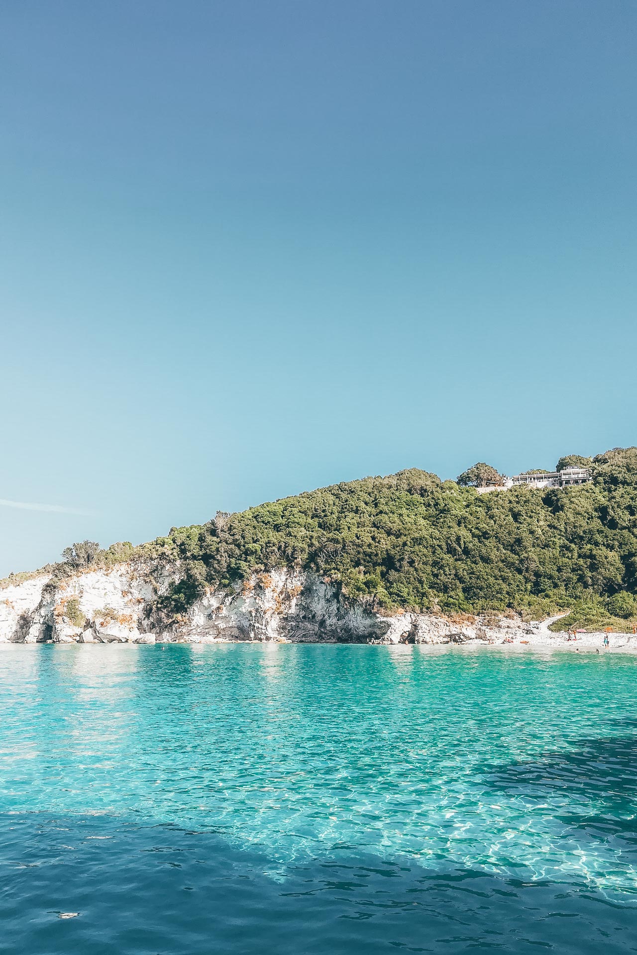 The intimate feeling is made all the more special by the thick greenery surrounding it, Voutoumi beach