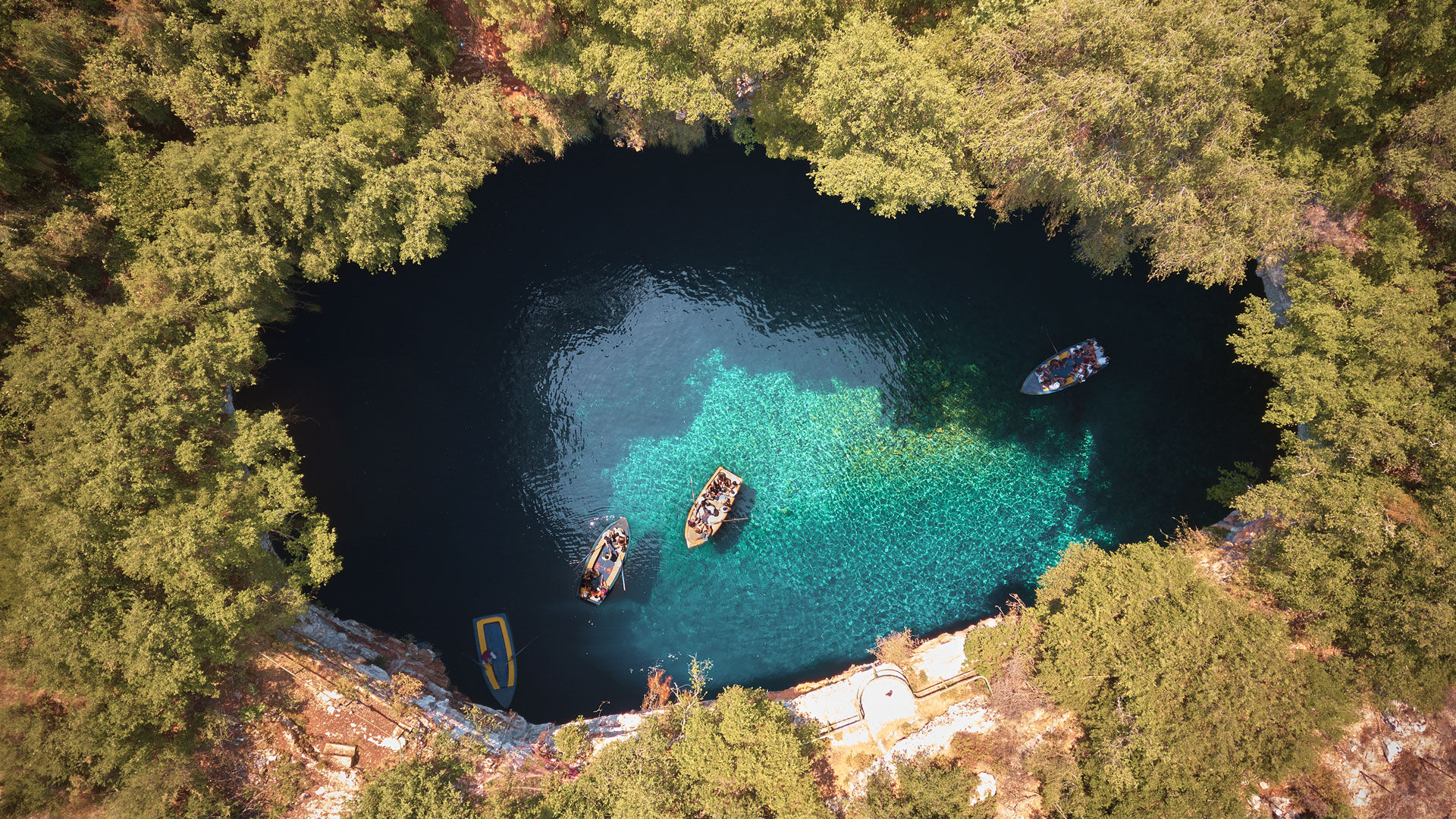Through a 36m tall opening, the shafts of daylight that come streaming in from above bounce off the water and light up the chamber with ethereal blues