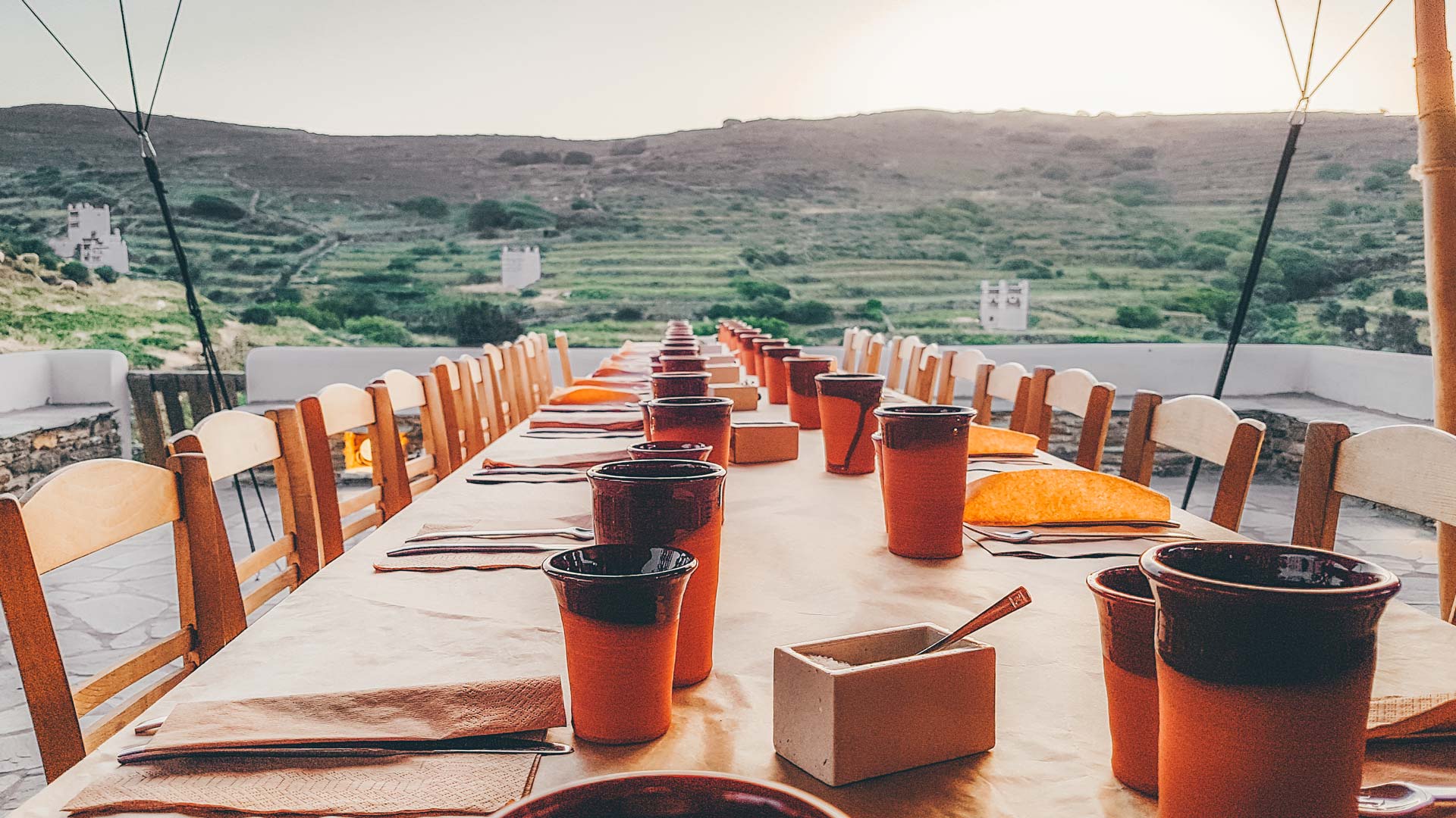 Dinner with a view of Peristerones-typical Tinian landscape and one of the most impressive works of art in the Cyclades