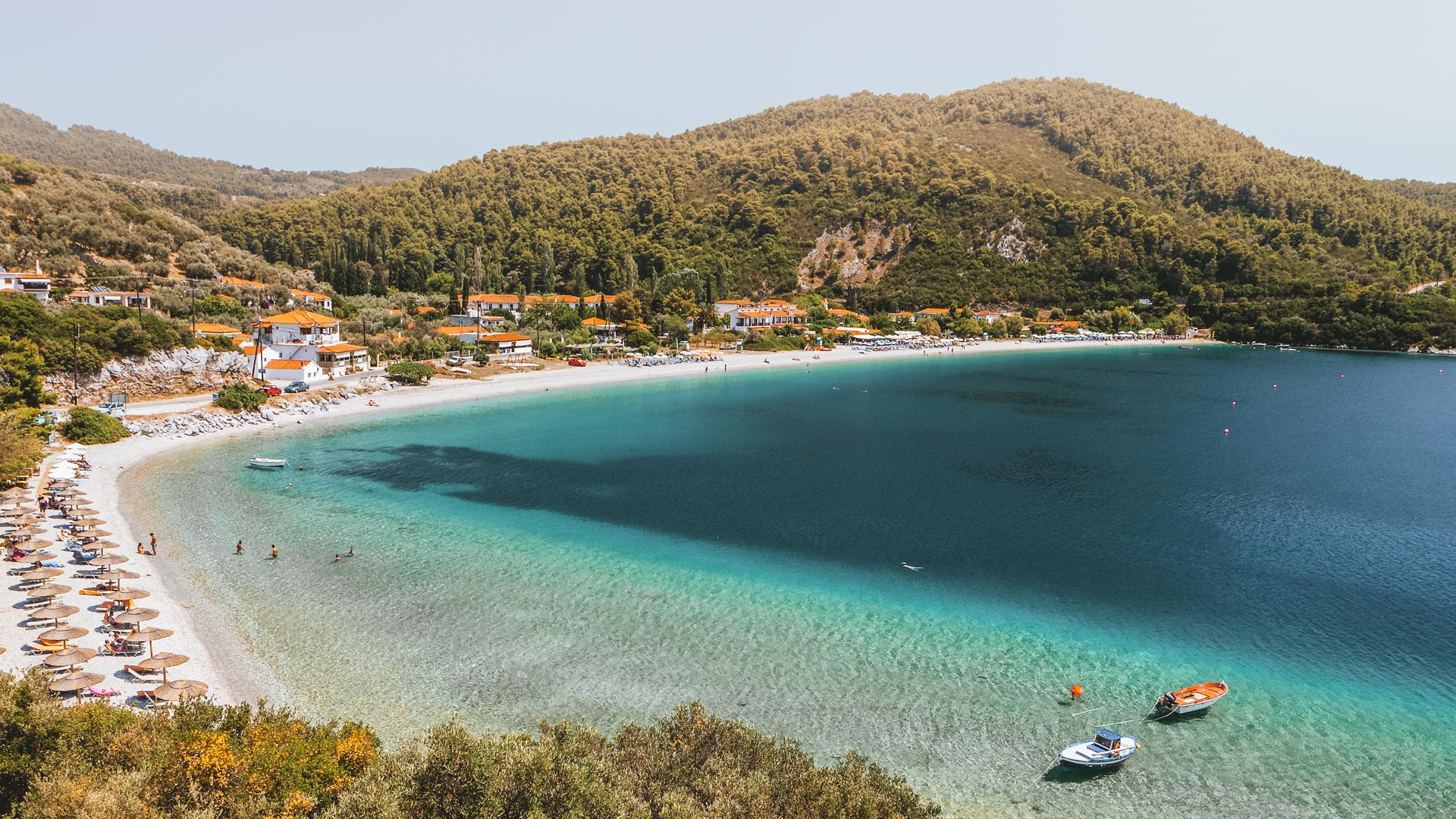 In a setting of tranquil green and blue, Panormos is one of the most welcoming beaches in Skopelos