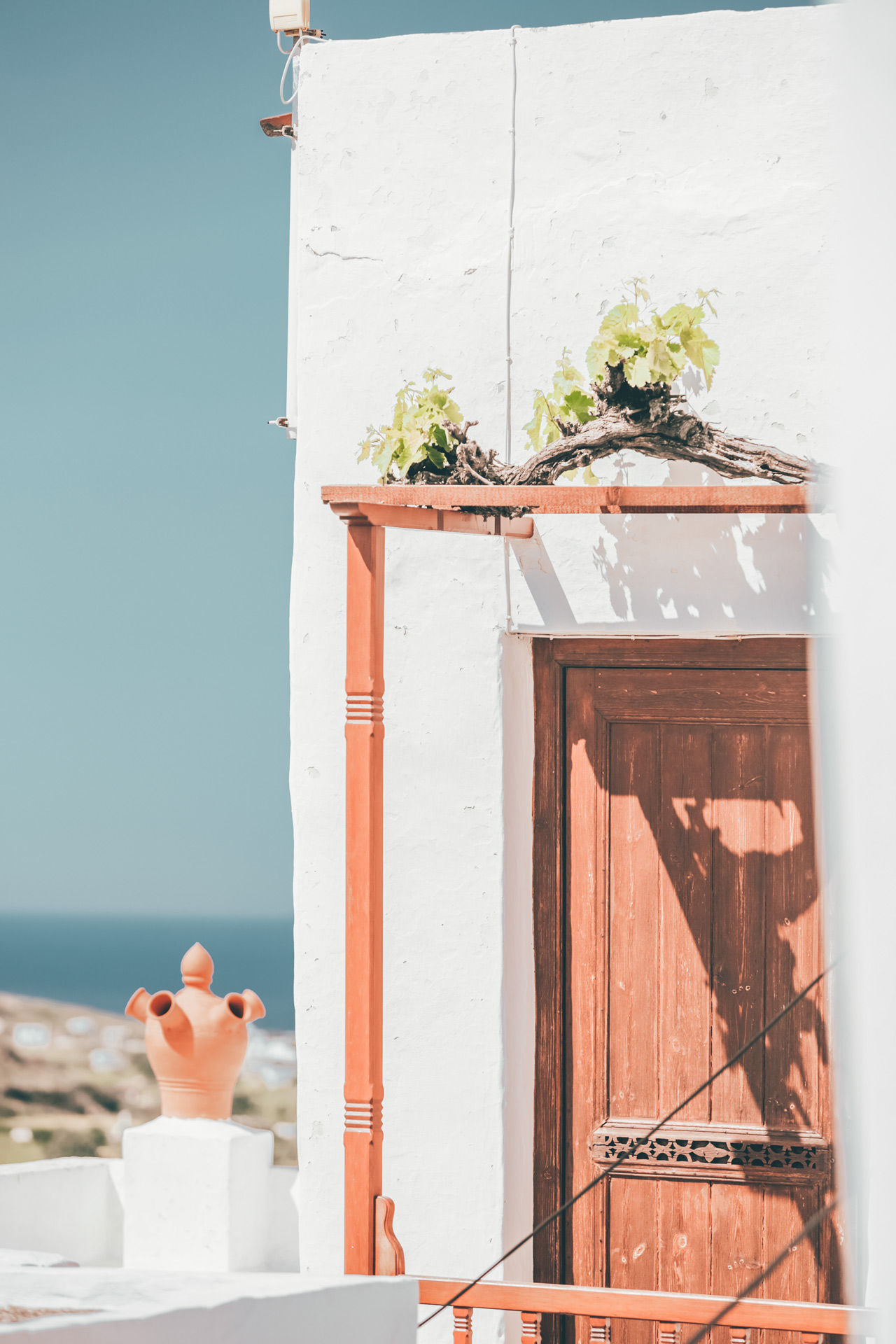 Peer through open doors and windows at the living-rooms proudly decorated with colourful ceramics
