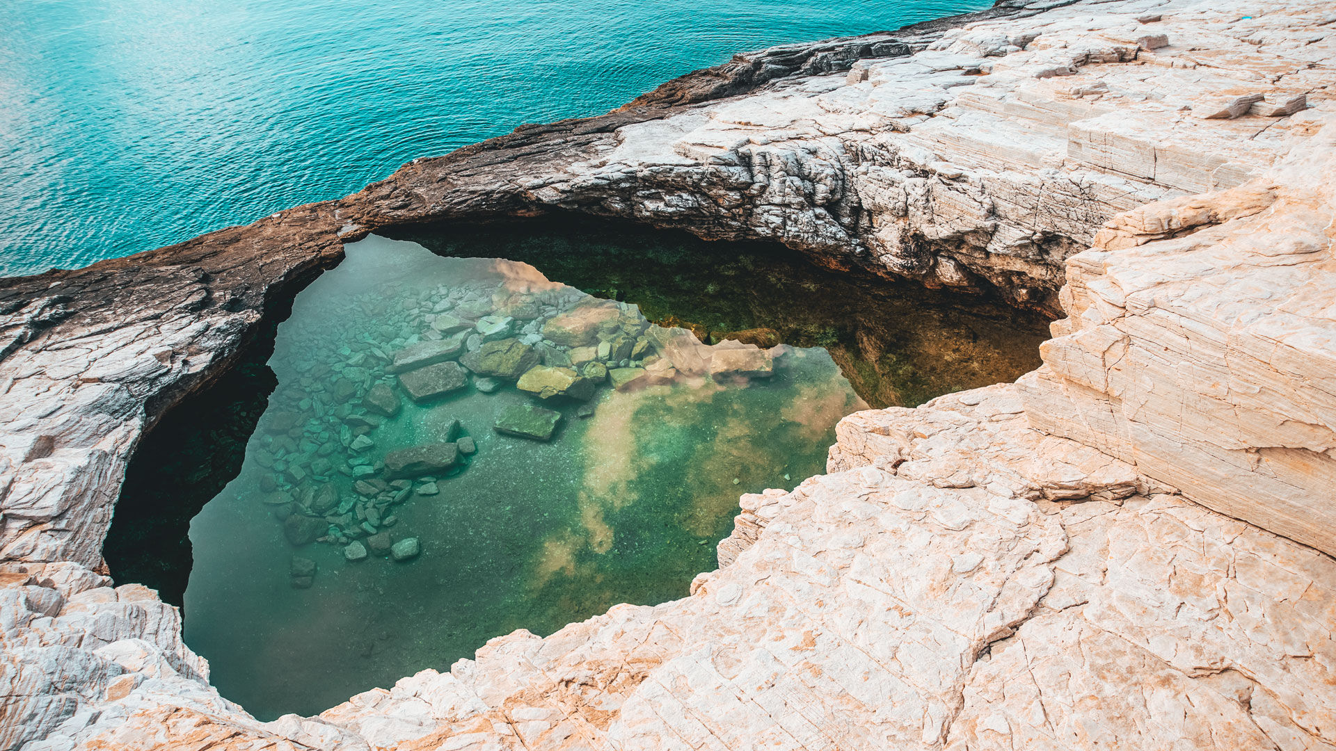 The water is warmer than the sea and the colours are a constantly shifting blue and green
