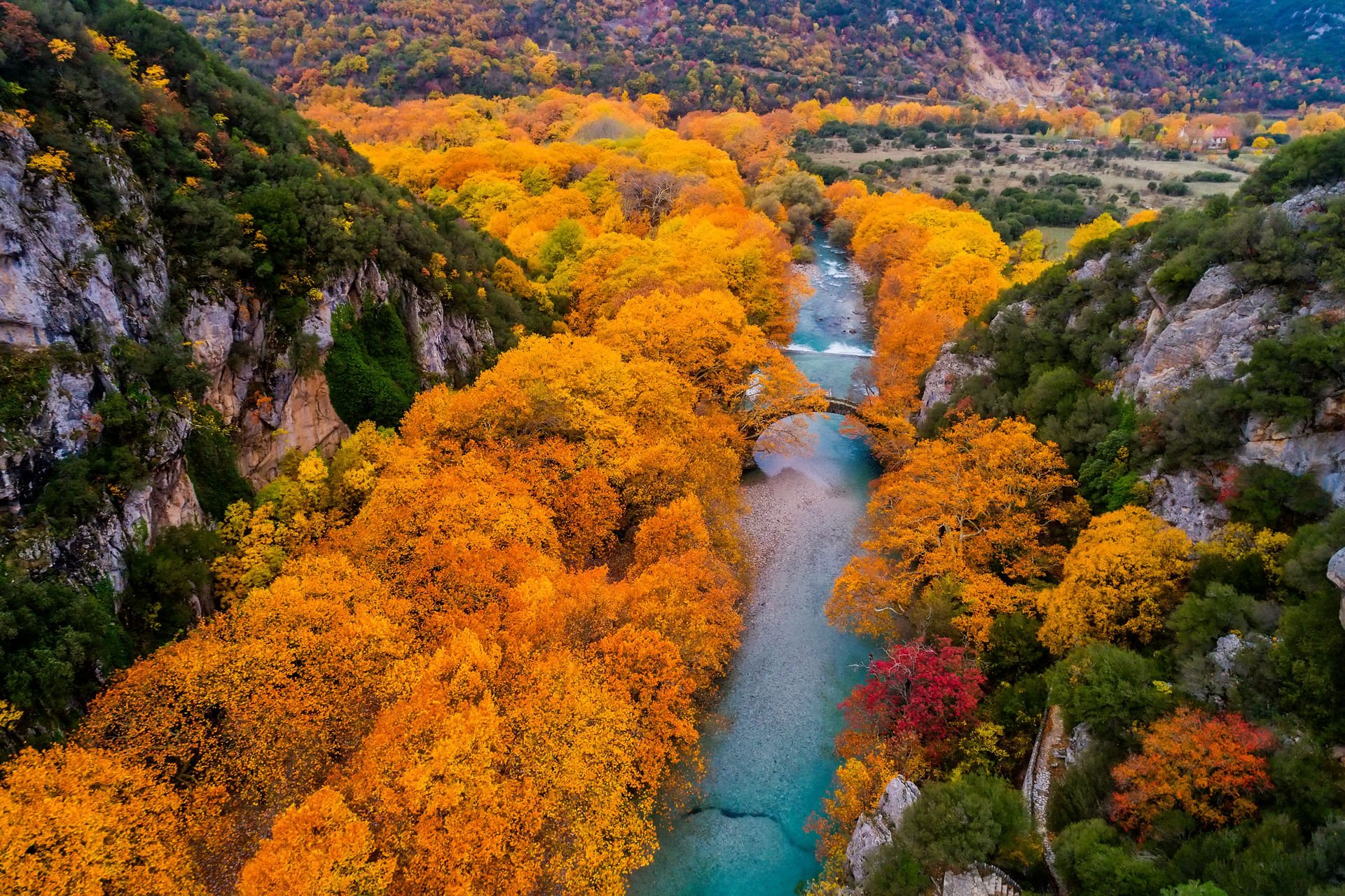 Aerial view of the Old stone bridge in Klidonia Zagoria in the autumn, Epirus, Western Greece. This arch bridge with elongated arch built in 1853.
