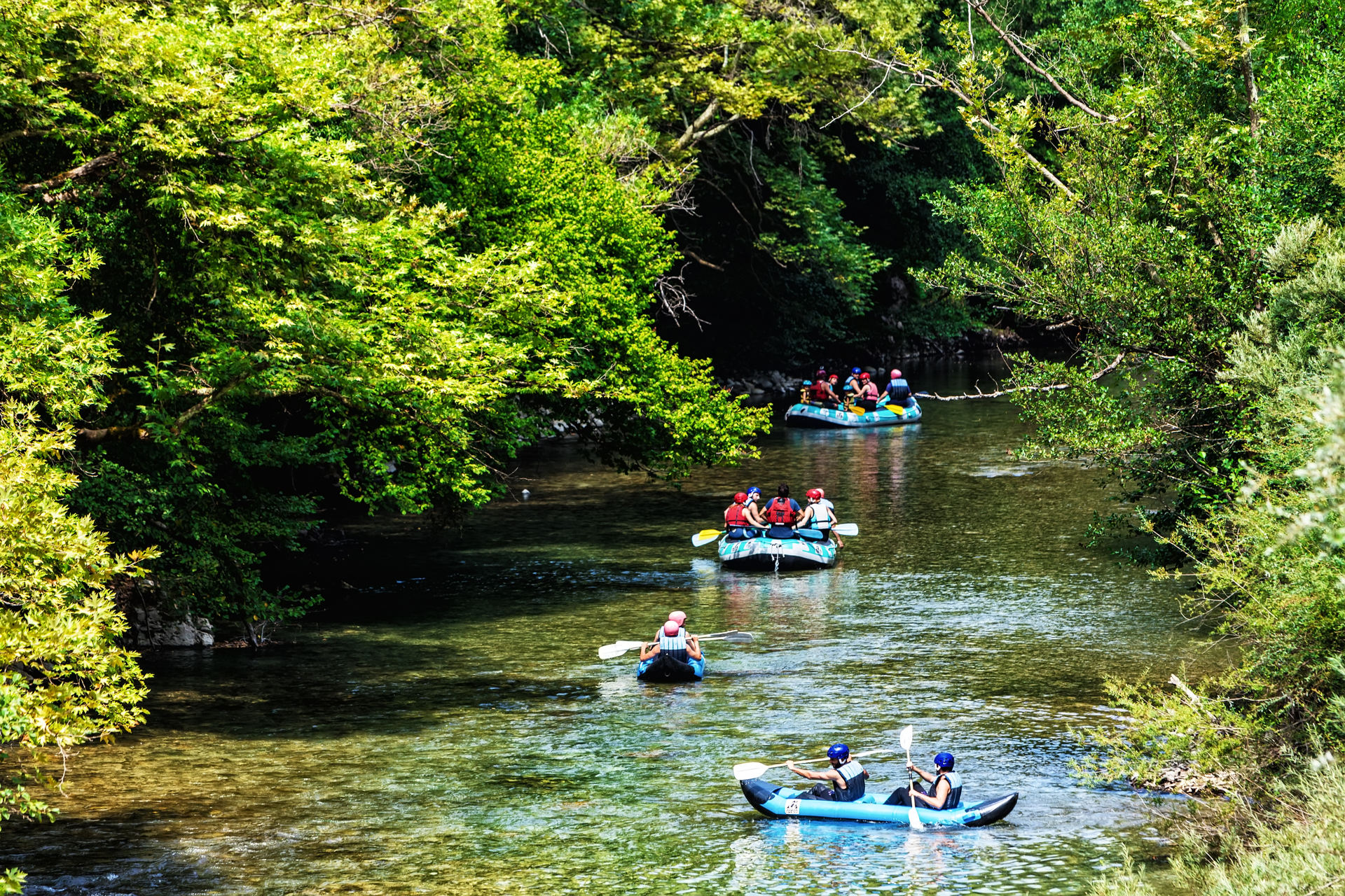 Adventure teams doing rafting on the cold waters of the Voidomatis 
