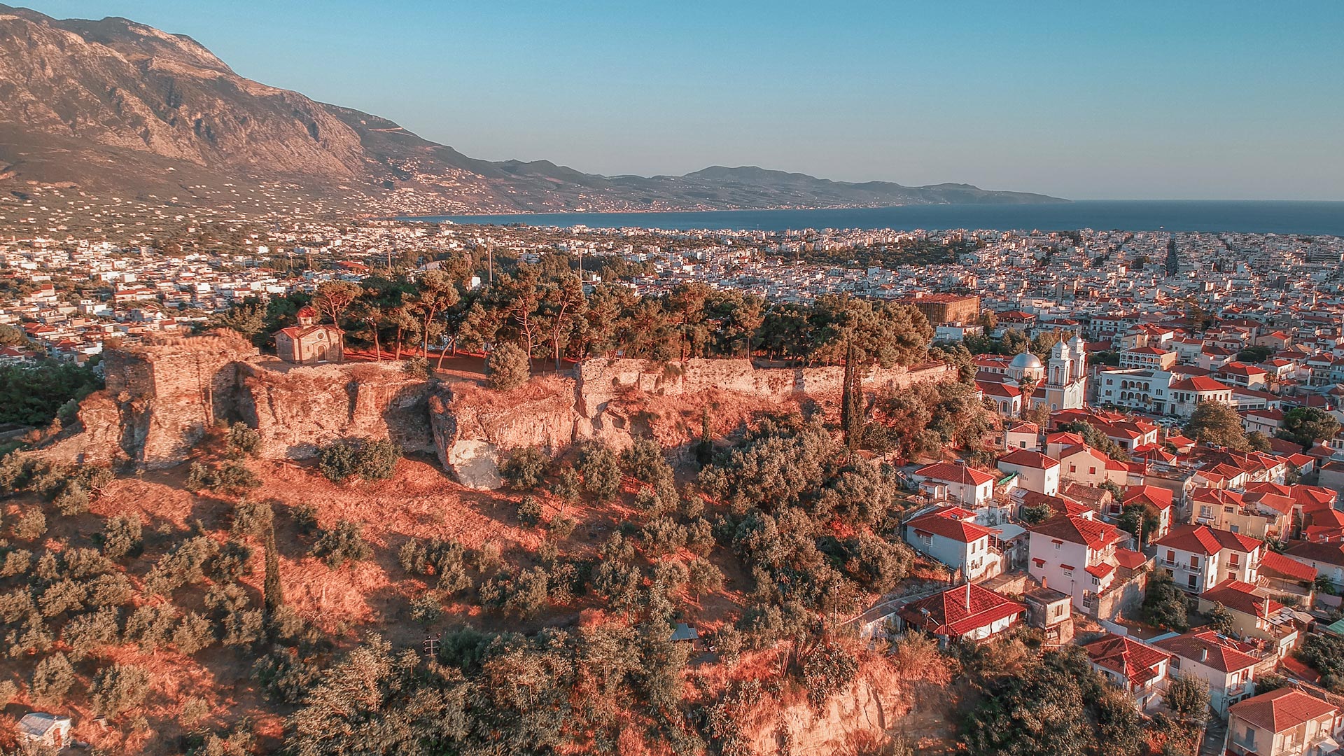 Aerial view of the wonderful old town of Kalamata City and the historical Castle at Sunset