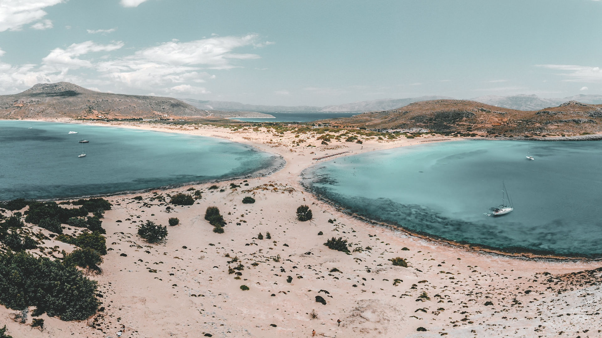 Two majestic bays serve up fine white sand and emerald water, and a rare cedar forest that spreads out along the sand dunes