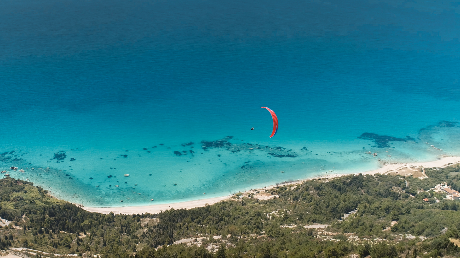 As you laze on the beach, paragliders will occasionally drift overhead