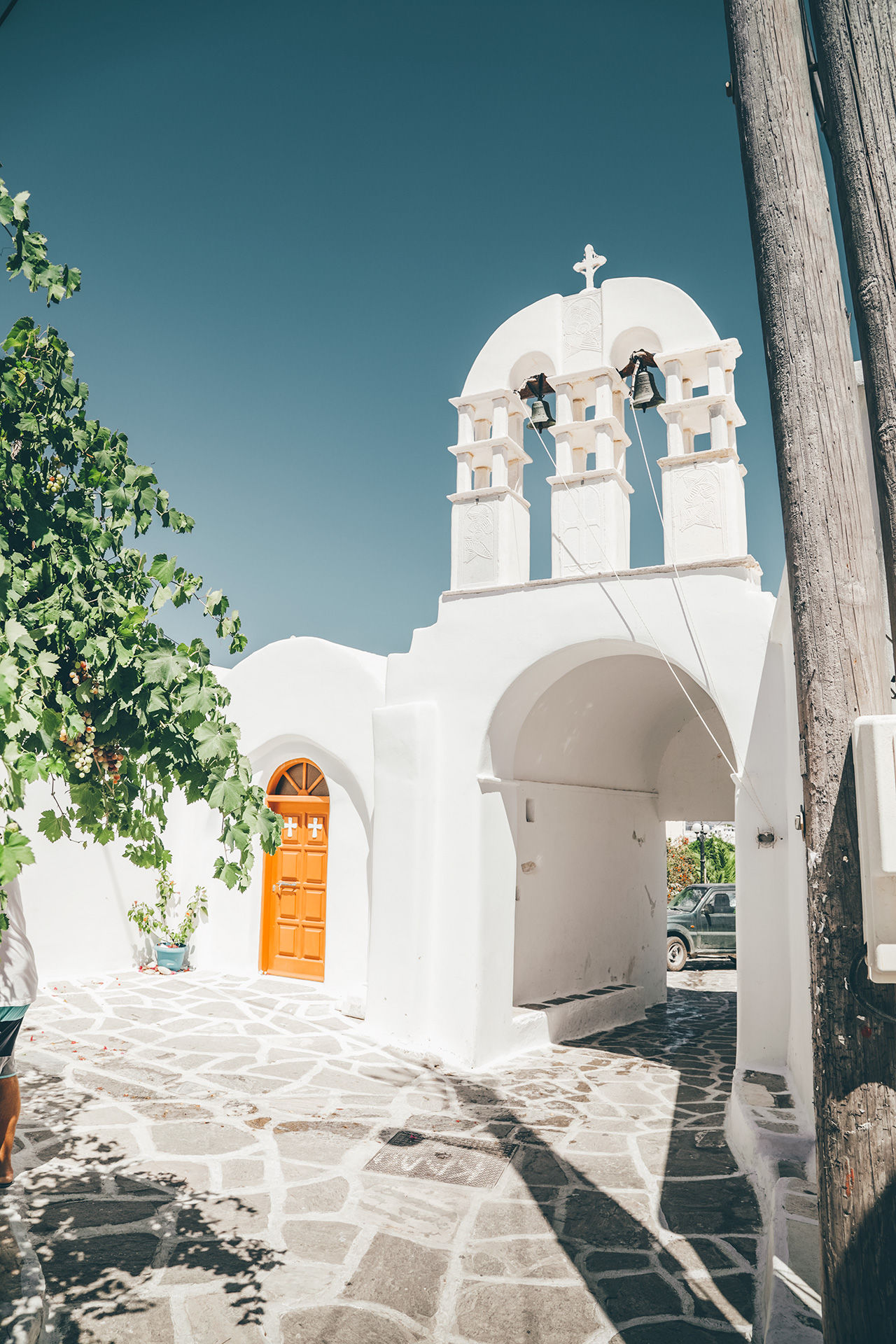 View of church and cycladic alleyway in Prodromos village