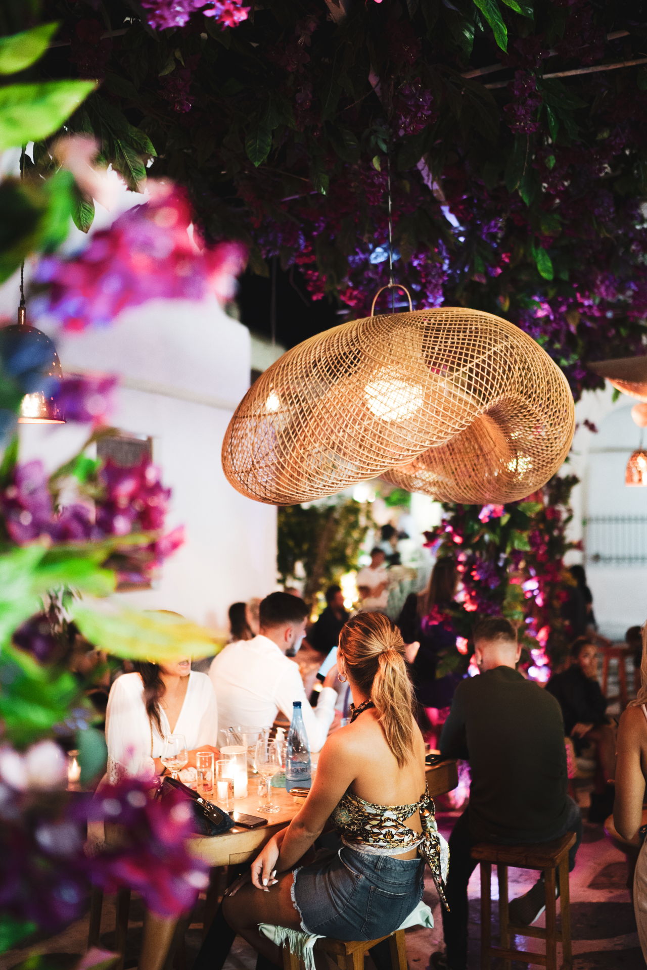 You could be lounging on cushions outside a gorgeous little bar in one of the alleyways in town, surrounded by all that Cycladic blue-and-white.