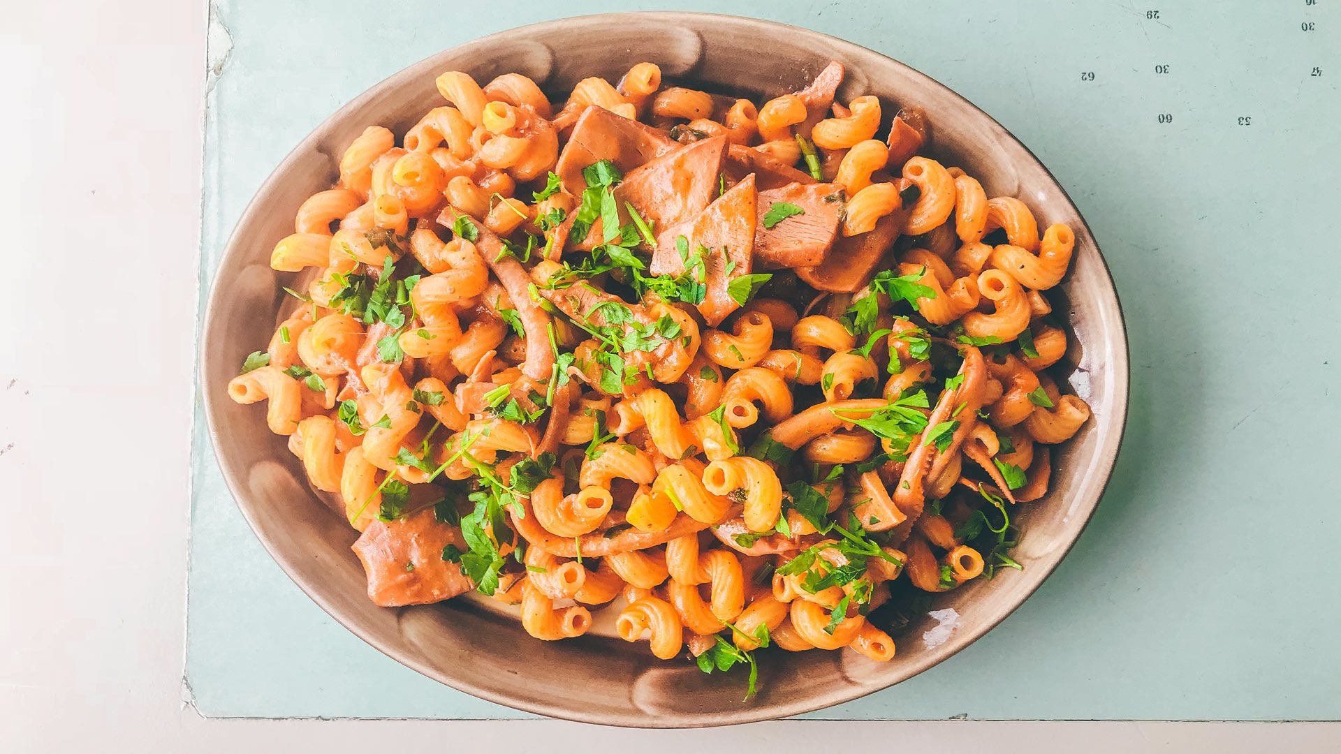 Homemade pasta with tomato and fresh squid