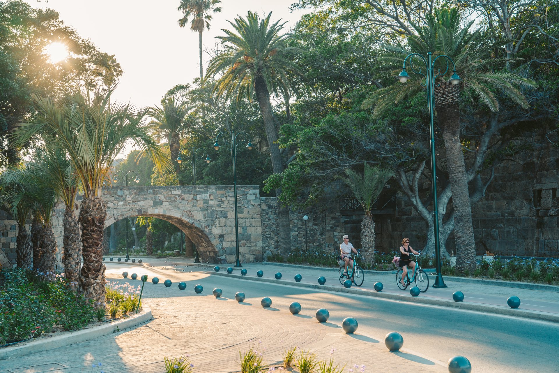 Cycling down the aptly named Finikon (Palm Tree) Avenue