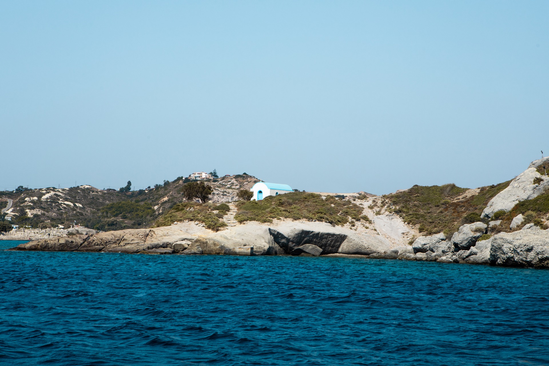 View of the islet of Kastri within the bay of Agios Stefanos