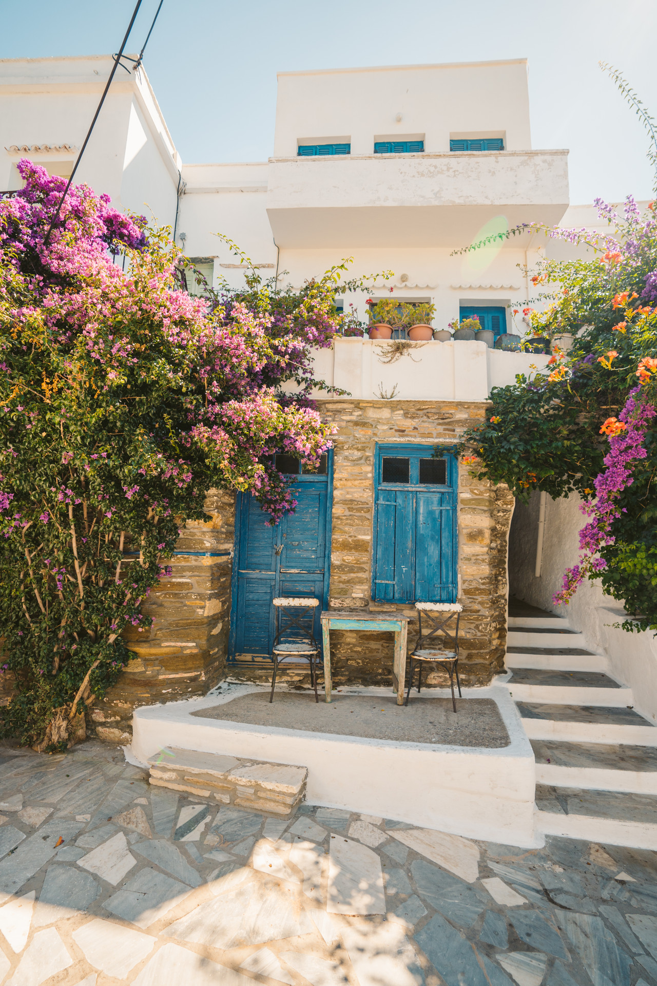 The villages of Tinos are full of idyllic little alleyways and bougainvillea-filled courtyards
