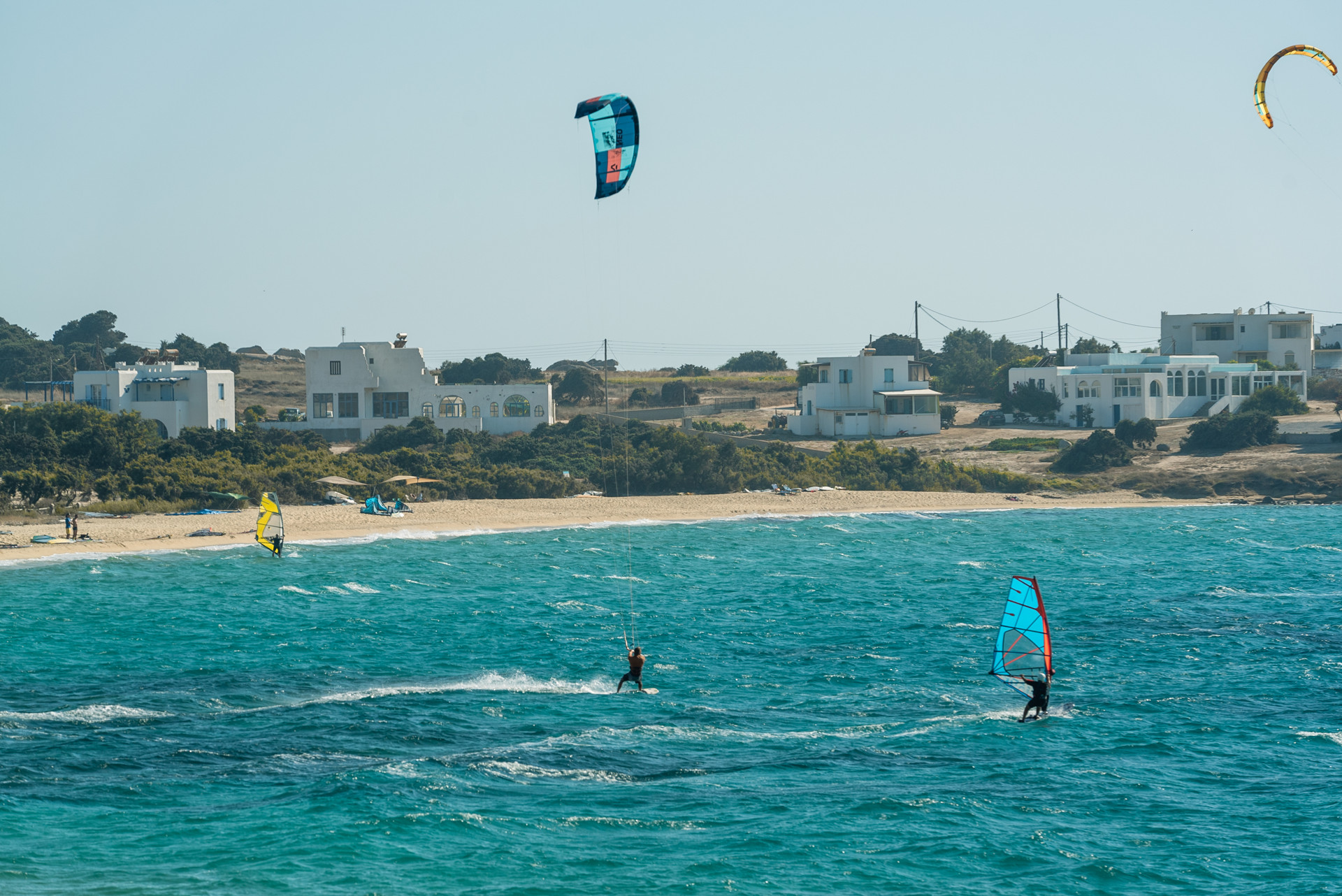 The wind conditions at Plaka beach make it a magnet for windsurfers and kitesurfers