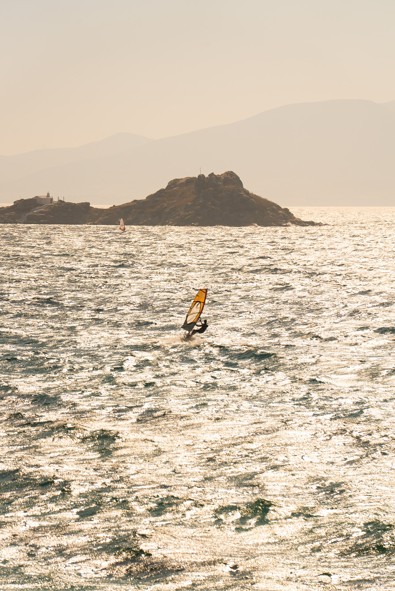Sunset windsurfing at Mikri Vigla beach in Naxos