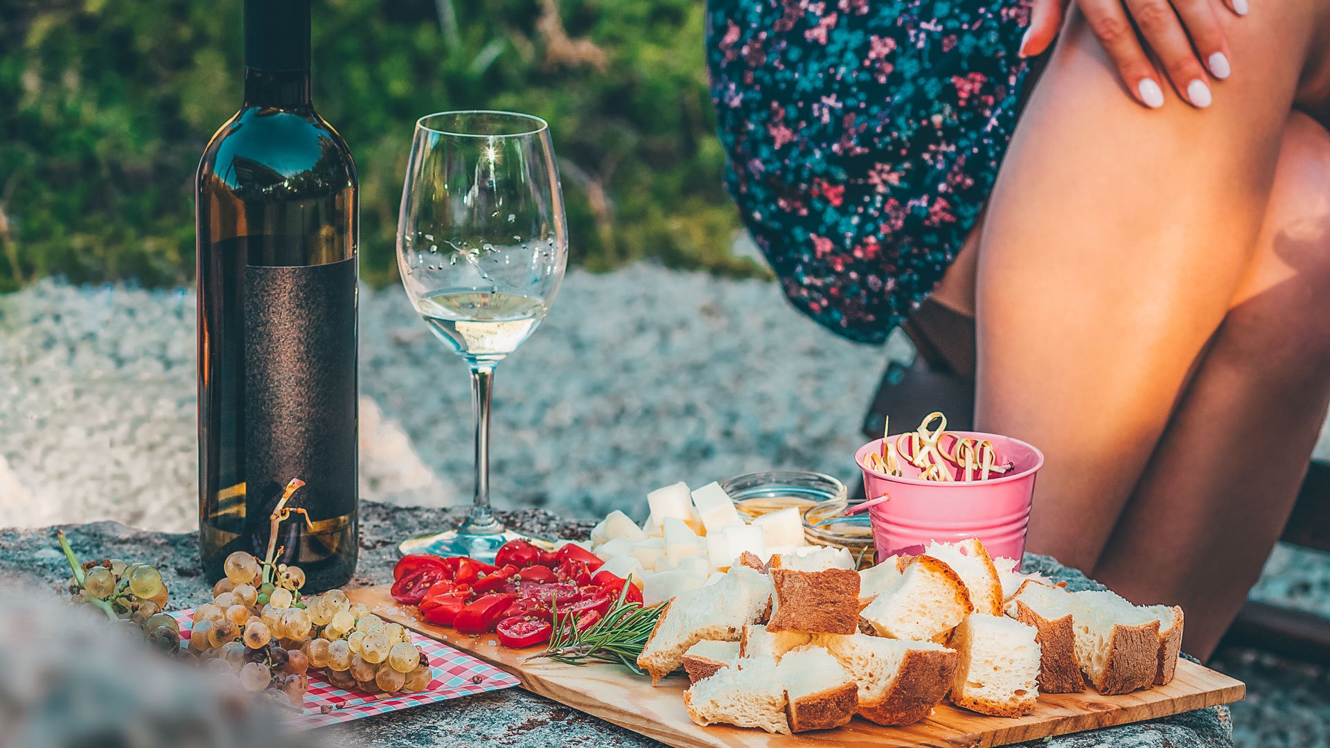 White cheese and bread with tomatoes on a stone table