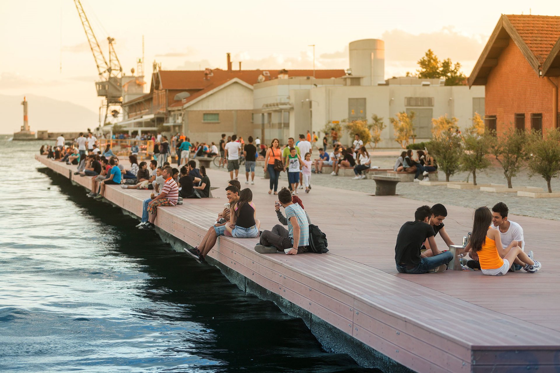 Young people relaxing and talking at the Thessaloniki beach