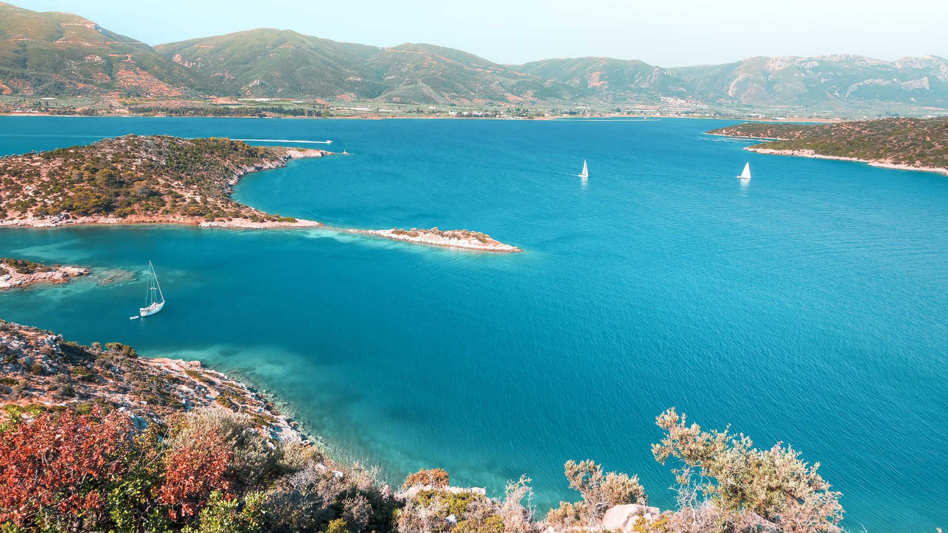 Yachts in a quiet bay in Poros