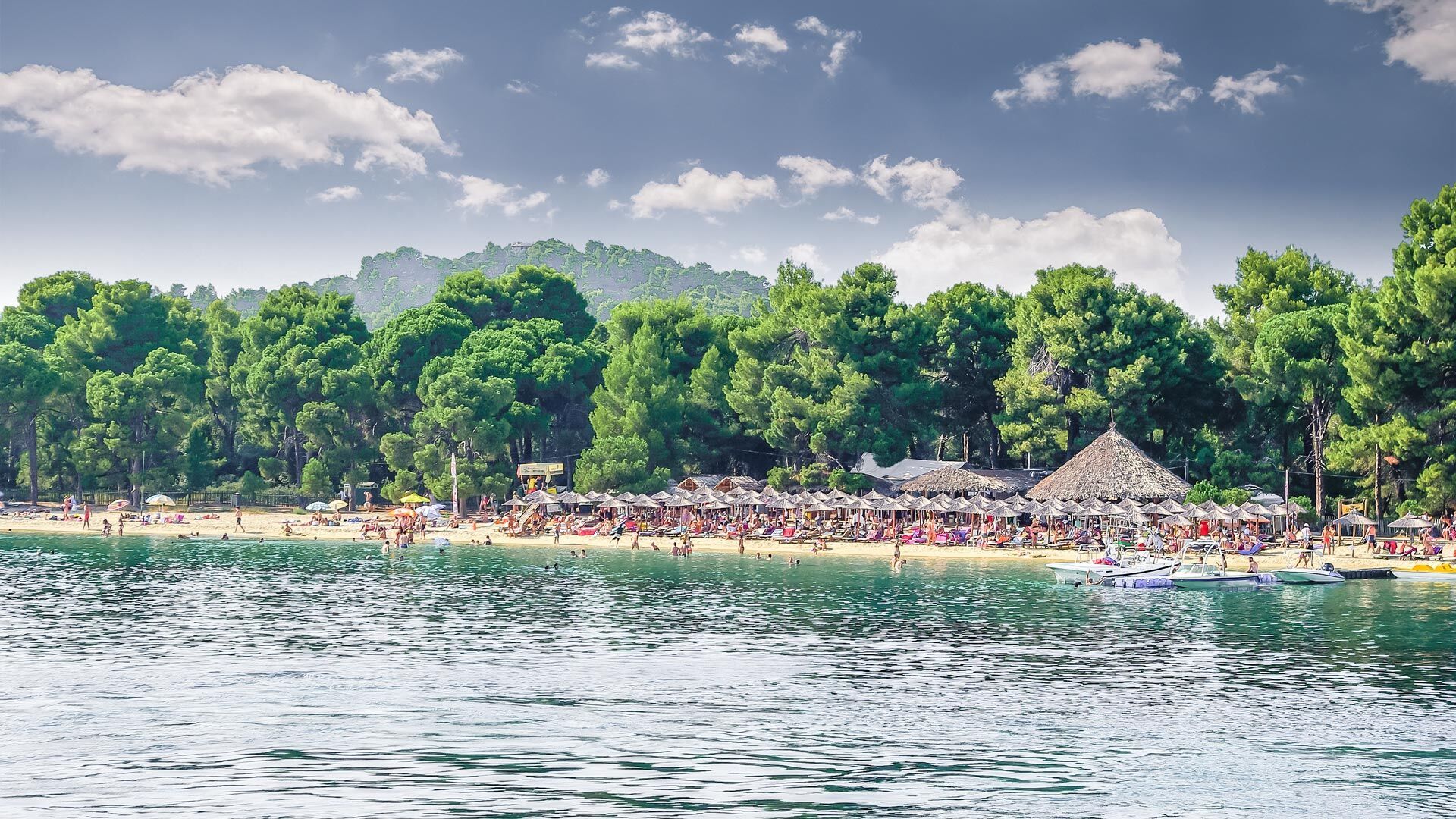 Alongside its natural beauty, Koukounaries beach is accompanied by an array of sunbeds, watersports and bars