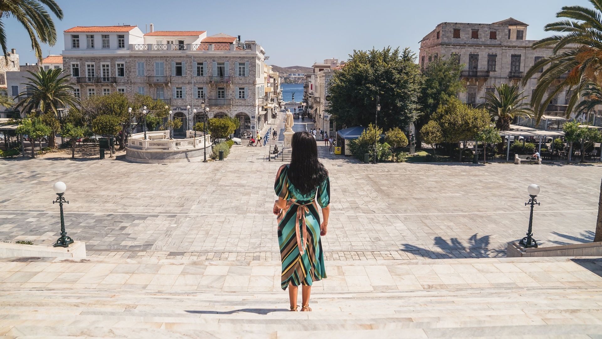 Miaouli Square with its grand Town Hall, palm trees and cafes and shops