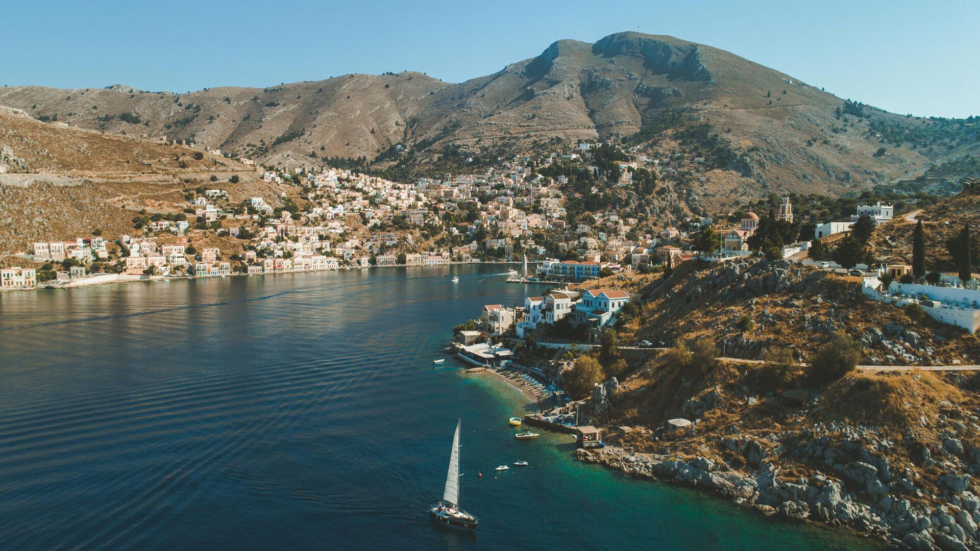 Arriving at Gialos, Symi’s main port imprints itself into your memory like a photograph.