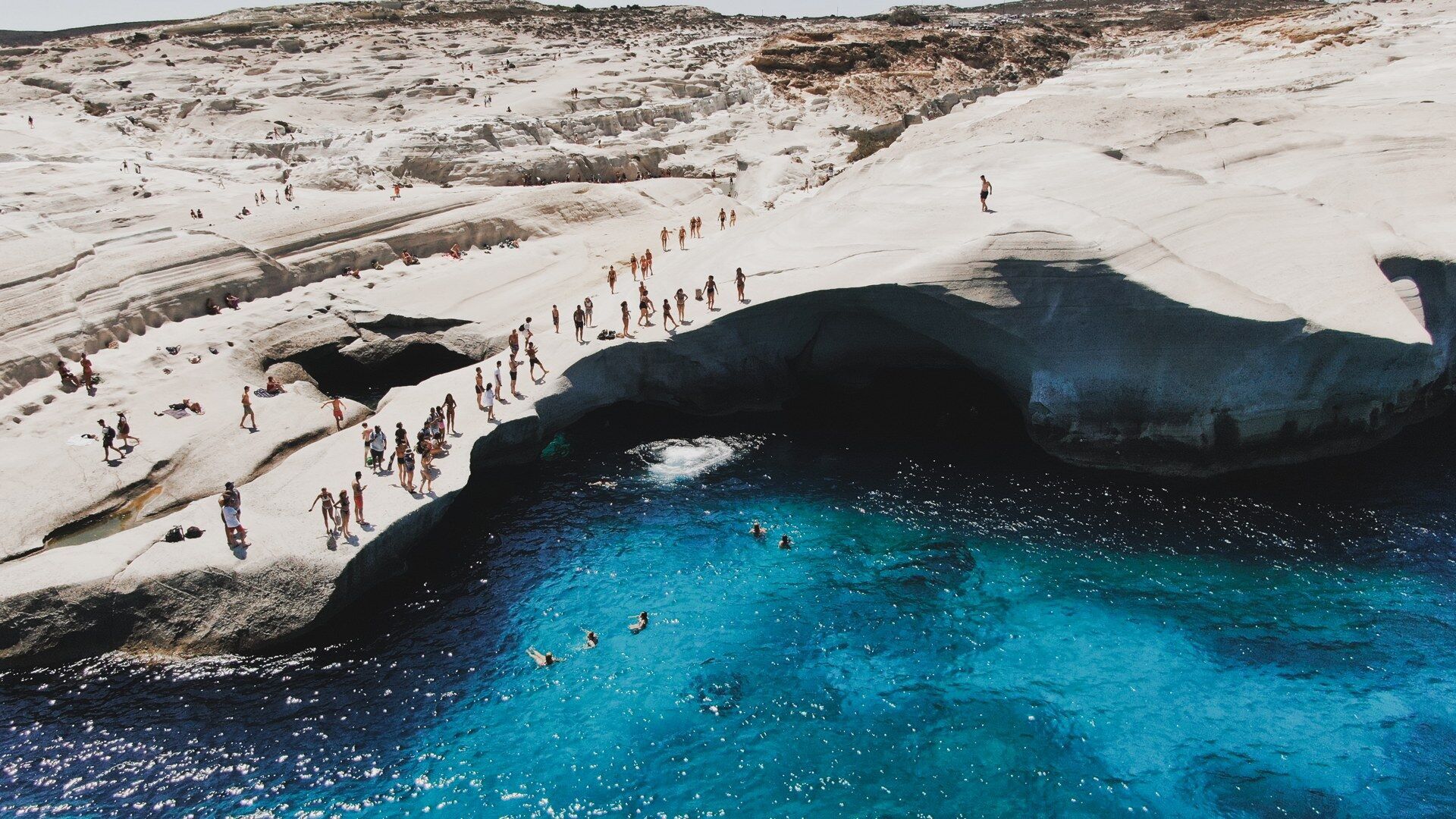 Dive from the limestone-white rocks of Sarakiniko