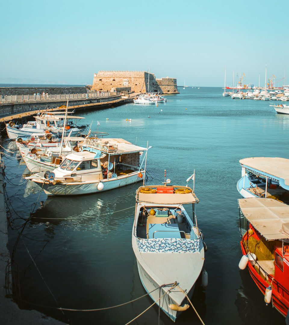 Fishing boats at Heraklion harbour and Koules Fortress