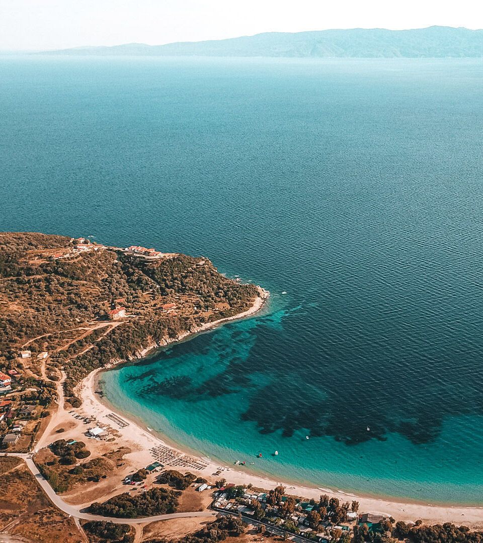 Alikes,-one-of-most-beautiful-and-popular-beaches-on-the-island,-looking-onto-the-Sithonia-peninsula-DJI_0190_Αμμουλιανή-Δρένια