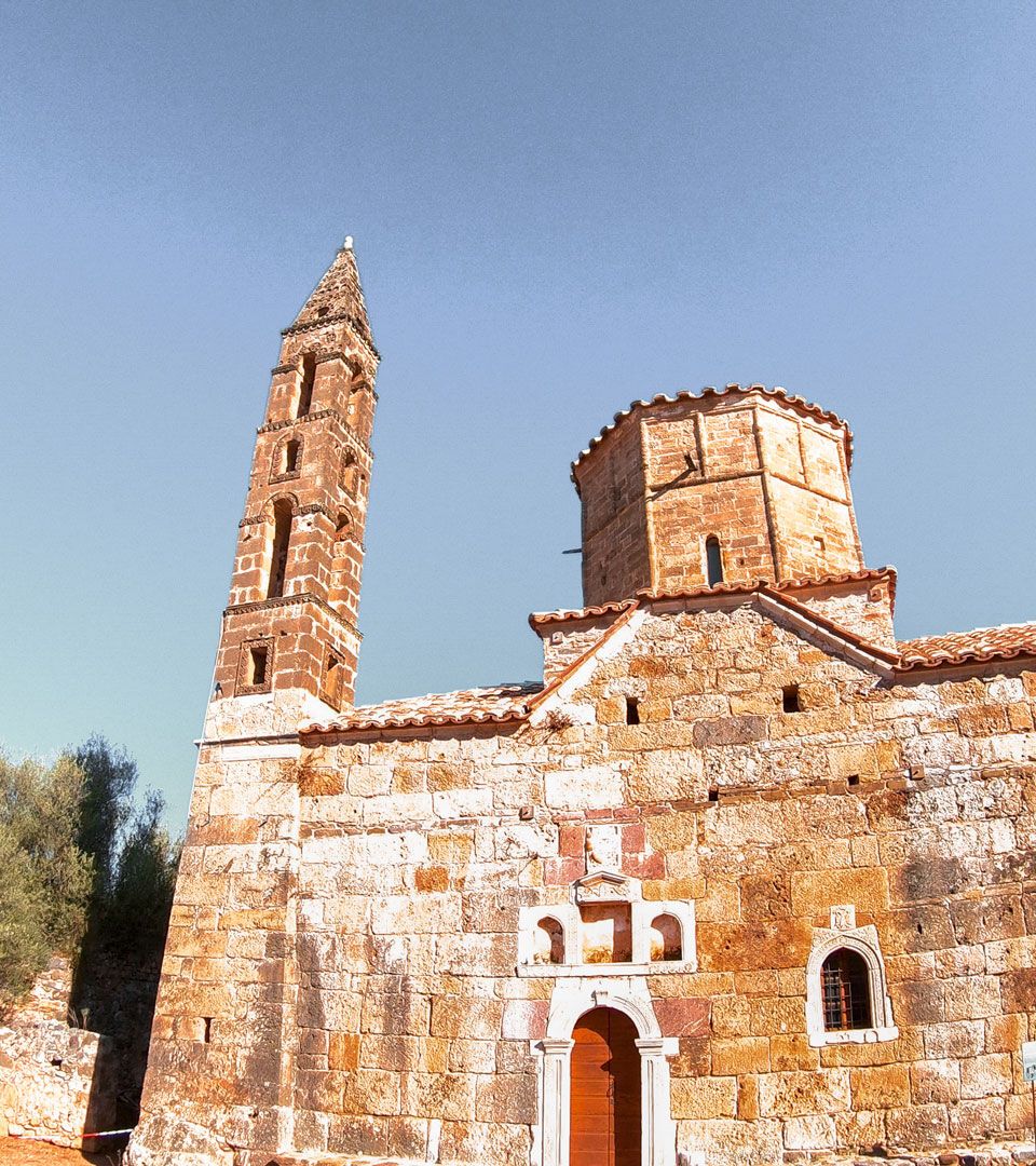 Old Kardamyli, a fortified cluster of towerhouses, rises around the 18th-century church of Agios Spyridon