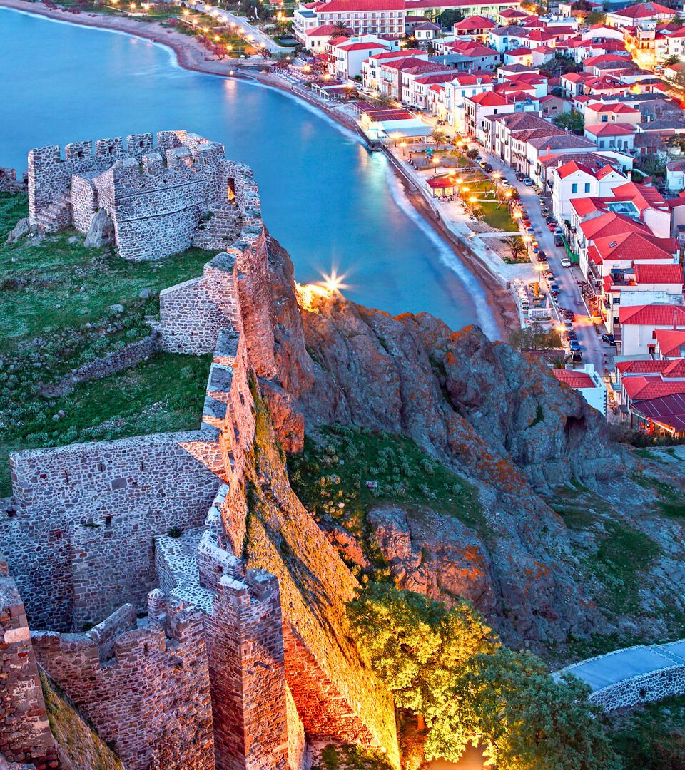 Partial view of the town of Myrina, its castle and the beach you of Romeikos Gyalos