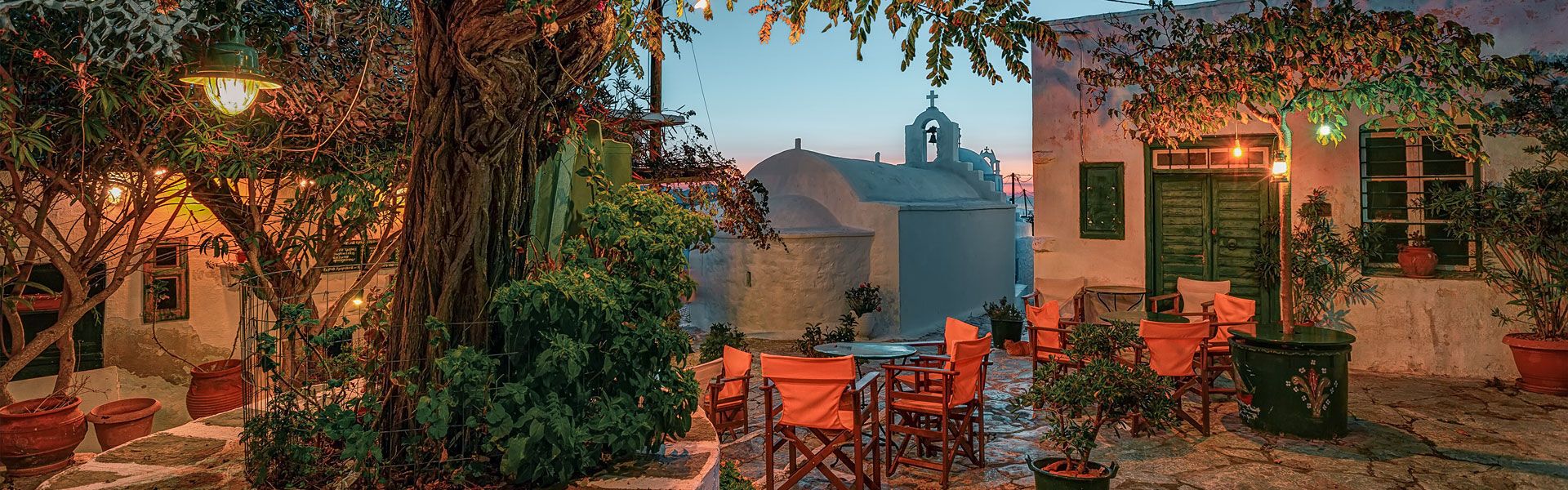 Small traditional paved square at dusk, Hora Amorgos