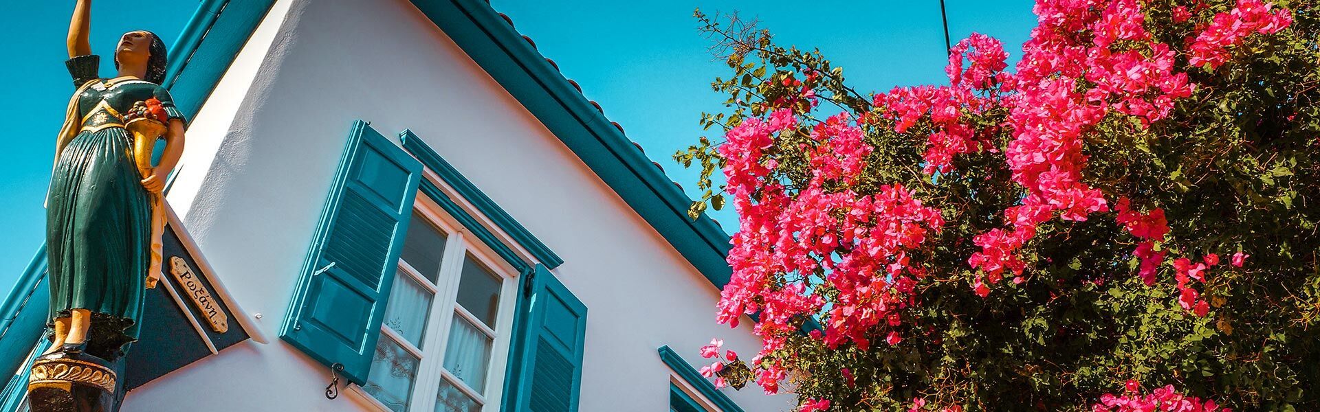 Traditional house with bourgainvillea in Galaxidi