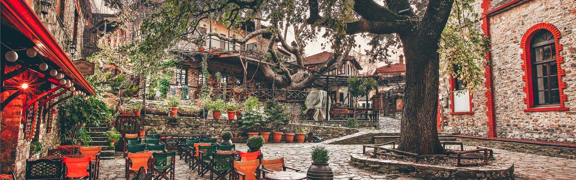 The picturesque square of Palaios Panteleimonas village around sunset , Pieria