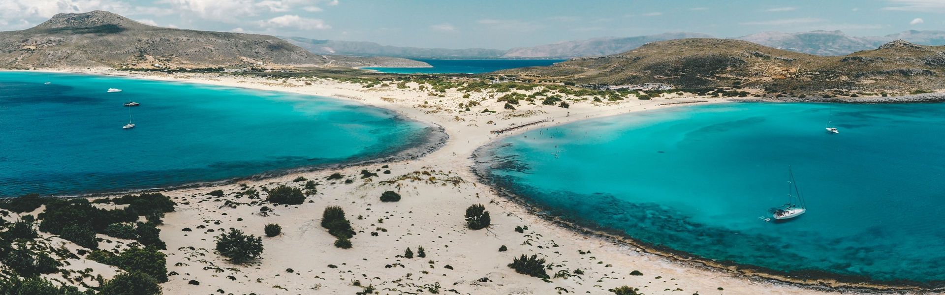 Two majestic bays serve up fine white sand and emerald water, and a rare cedar forest that spreads out along the sand dunes