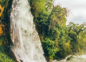 Famous Keranos waterfall drops 70m among plane trees that were seeded centuries hence