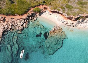 The southern part of the island is embroidered with beaches, charming bays and green-blue water